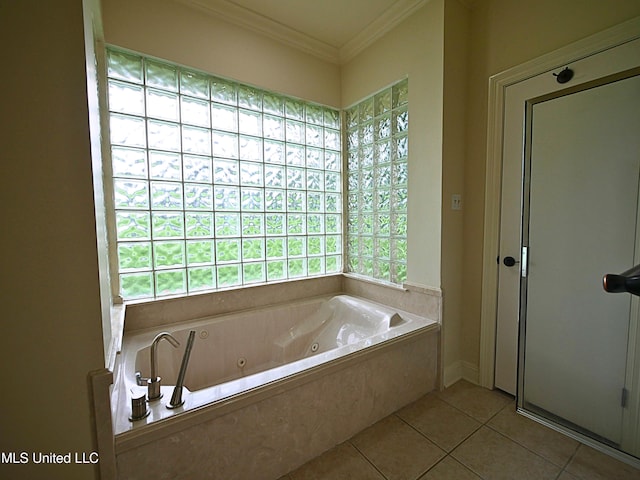 6936 Aulena Pl, Diamondhead, MS 39525 - bathroom featuring tile patterned floors, plenty of natural light, a whirlpool tub, and ornamental molding
