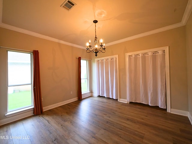 6936 Aulena Pl, Diamondhead, MS 39525 - spare room with a chandelier, plenty of natural light, dark wood-style floors, and ornamental molding