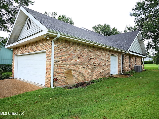 6936 Aulena Pl, Diamondhead, MS 39525 - view of home's exterior with a yard, driveway, brick siding, and roof with shingles