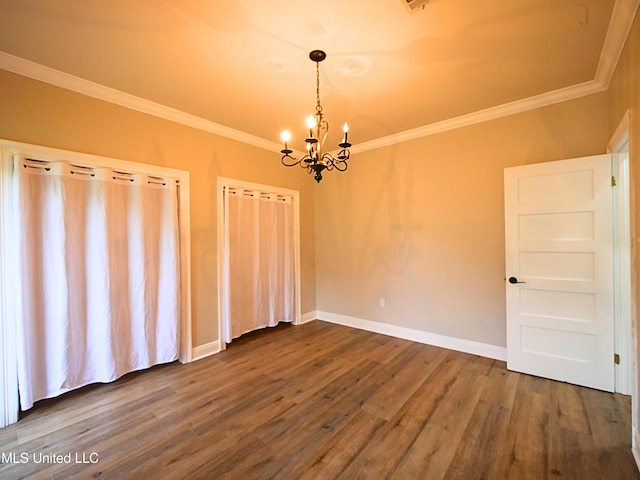 6936 Aulena Pl, Diamondhead, MS 39525 - spare room featuring a chandelier, crown molding, and dark wood-type flooring