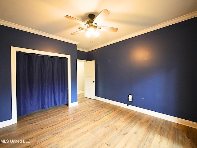 6936 Aulena Pl, Diamondhead, MS 39525 - unfurnished room with a ceiling fan, wood finished floors, and crown molding