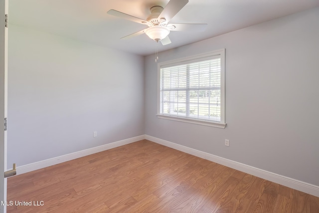 1025 Shipp St, Waveland, MS 39576 - empty room featuring light wood-type flooring, baseboards, and a ceiling fan