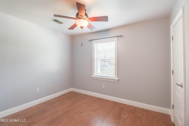 1025 Shipp St, Waveland, MS 39576 - empty room featuring a ceiling fan, baseboards, and light wood-type flooring