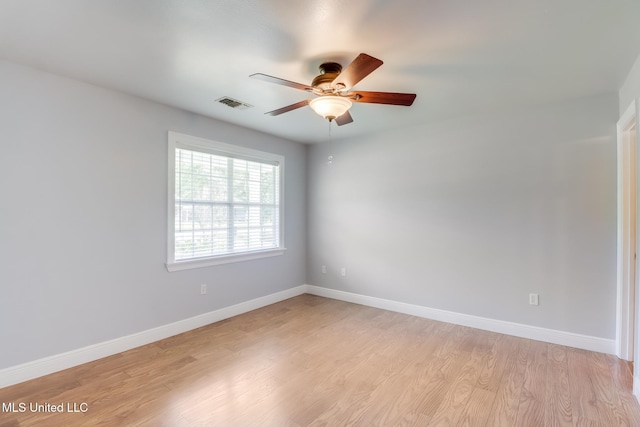 1025 Shipp St, Waveland, MS 39576 - empty room featuring ceiling fan, light wood finished floors, and baseboards