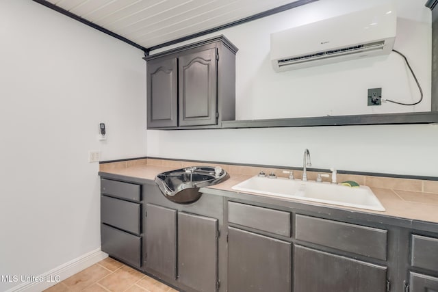 1025 Shipp St, Waveland, MS 39576 - bathroom featuring a wall mounted AC, vanity, baseboards, tile patterned flooring, and ornamental molding