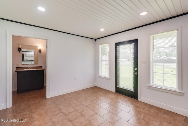 1025 Shipp St, Waveland, MS 39576 - foyer with plenty of natural light, light tile patterned flooring, baseboards, and recessed lighting