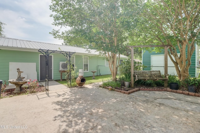 1025 Shipp St, Waveland, MS 39576 - view of front of house featuring a patio and metal roof