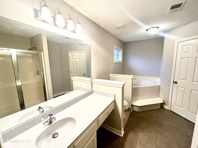 7827 S Chesterfield Dr, Southaven, MS 38671 - bathroom featuring toilet, tile patterned flooring, vanity, a stall shower, and a garden tub