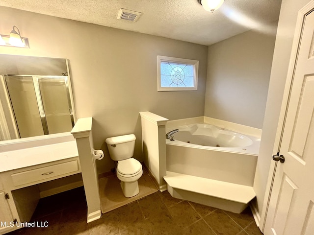 7827 S Chesterfield Dr, Southaven, MS 38671 - bathroom with a textured ceiling, a jetted tub, toilet, a stall shower, and tile patterned flooring