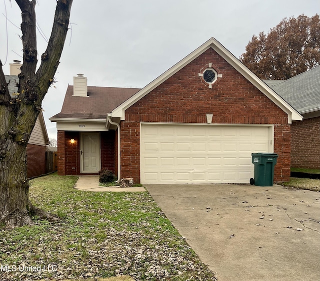7827 S Chesterfield Dr, Southaven, MS 38671 - view of front of property featuring a chimney, driveway, brick siding, an attached garage, and a shingled roof