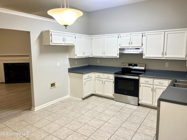 7827 S Chesterfield Dr, Southaven, MS 38671 - kitchen featuring stainless steel electric range, under cabinet range hood, dark countertops, light tile patterned flooring, and white cabinets
