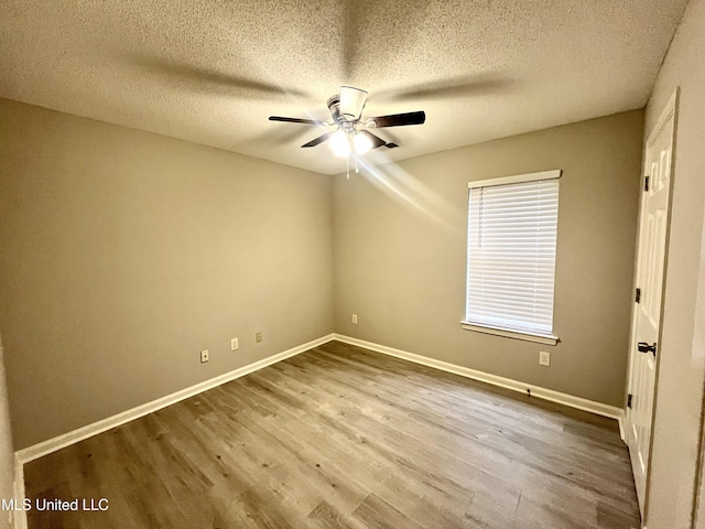 7827 S Chesterfield Dr, Southaven, MS 38671 - spare room featuring ceiling fan, wood finished floors, baseboards, and a textured ceiling