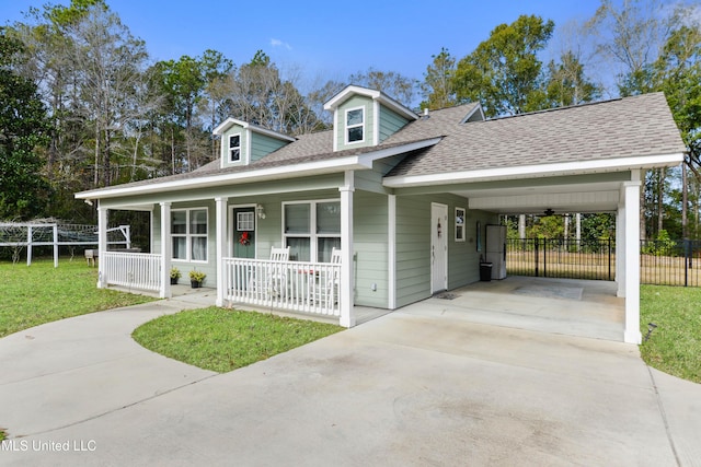 13701 Jericho Rd, Vancleave, MS 39565 - view of front of home featuring covered porch, a shingled roof, driveway, and an attached carport