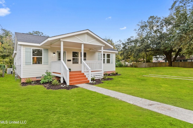 bungalow-style home with a porch and a front lawn