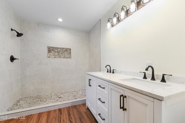 2312 6th Ave, Gulfport, MS 39501 - bathroom featuring tiled shower, double vanity, wood finished floors, and recessed lighting