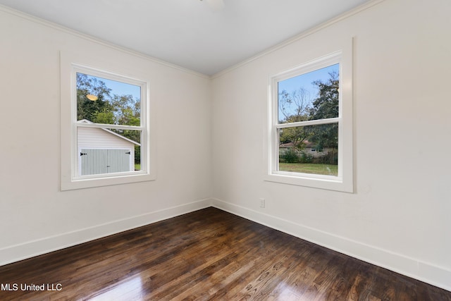 2312 6th Ave, Gulfport, MS 39501 - unfurnished room with plenty of natural light, baseboards, crown molding, and dark wood-type flooring