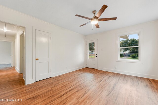 2312 6th Ave, Gulfport, MS 39501 - spare room with attic access, a ceiling fan, light wood-style flooring, and baseboards