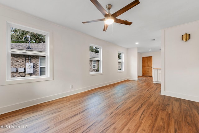 2312 6th Ave, Gulfport, MS 39501 - unfurnished room with a ceiling fan, baseboards, light wood finished floors, and recessed lighting