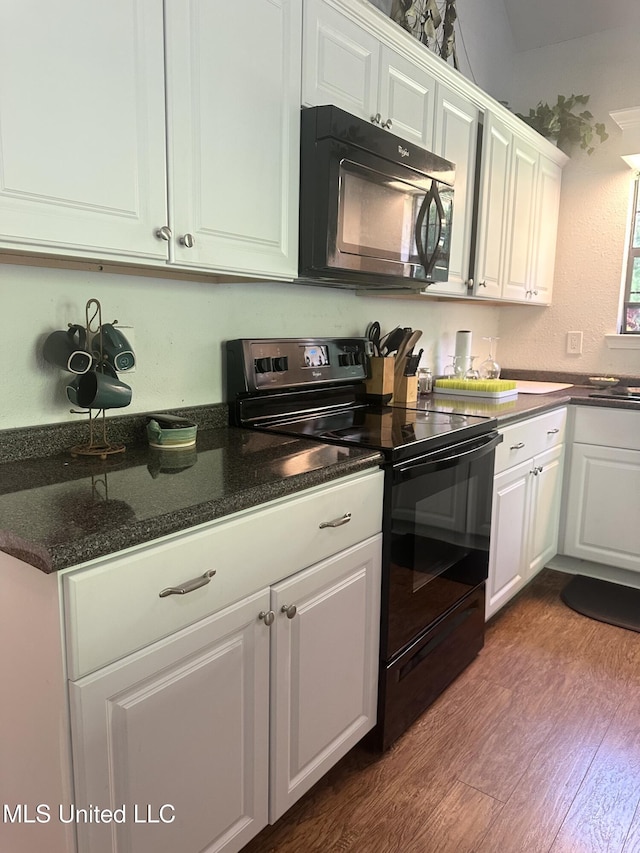 kitchen featuring black appliances, white cabinetry, and dark wood-style flooring