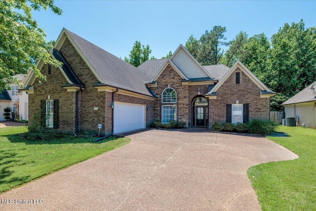 3753 Kenton Dr, Southaven, MS 38672 - traditional-style home with a front lawn, driveway, an attached garage, and brick siding