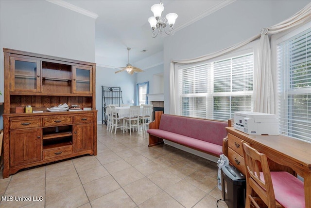 3753 Kenton Dr, Southaven, MS 38672 - living room with light tile patterned floors, crown molding, a chandelier, ceiling fan, and plenty of natural light