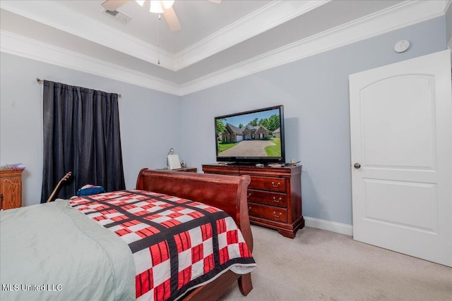 3753 Kenton Dr, Southaven, MS 38672 - bedroom with light colored carpet, crown molding, a tray ceiling, and ceiling fan