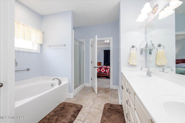 3753 Kenton Dr, Southaven, MS 38672 - bathroom featuring ensuite bathroom, a garden tub, a stall shower, and double vanity