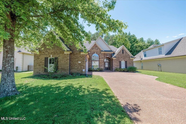 3753 Kenton Dr, Southaven, MS 38672 - traditional home with brick siding, concrete driveway, and a front yard