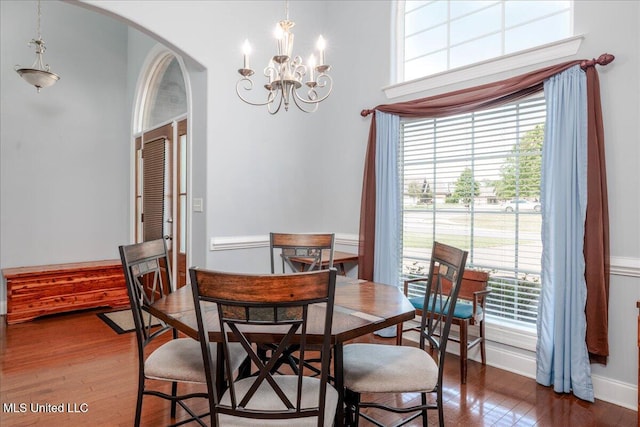 3753 Kenton Dr, Southaven, MS 38672 - dining space with arched walkways, wood finished floors, and a chandelier