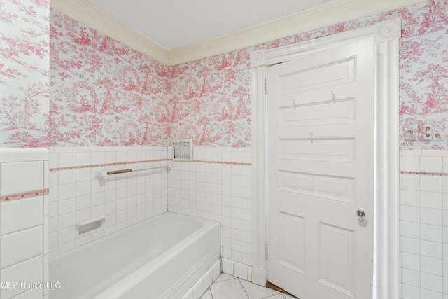 bathroom with a wainscoted wall, tile walls, wallpapered walls, tile patterned flooring, and a bath