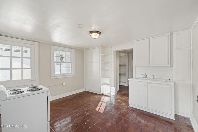 kitchen featuring a sink, white cabinetry, baseboards, open shelves, and white range with electric cooktop