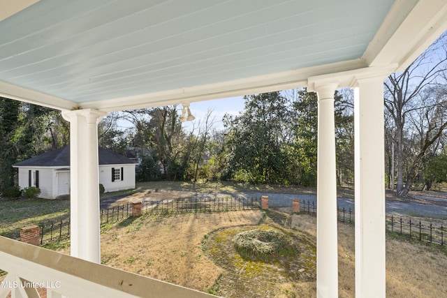 view of yard with fence and an outdoor structure