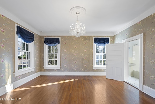 unfurnished dining area featuring hardwood / wood-style flooring and wallpapered walls