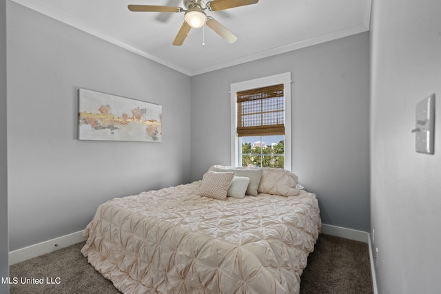 bedroom with ornamental molding, carpet, and ceiling fan