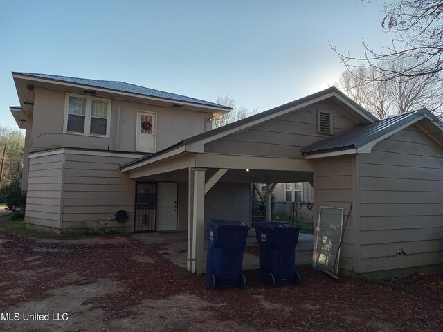 109 E Percy St, Indianola, MS 38751 - view of front facade with metal roof and an attached carport