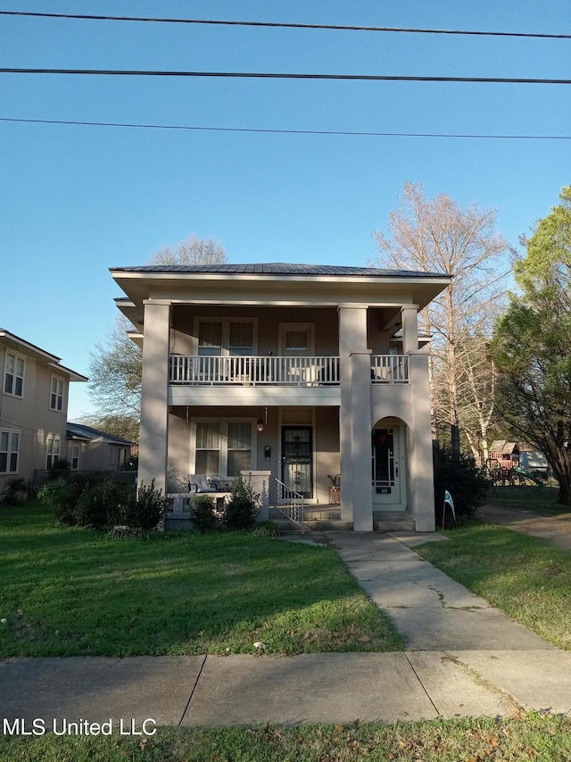 109 E Percy St, Indianola, MS 38751 - view of front of house with a balcony, a front lawn, and a porch