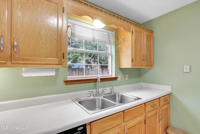 8809 Old Walnut Rd, Ocean Springs, MS 39564 - kitchen with a sink, light countertops, and light brown cabinets