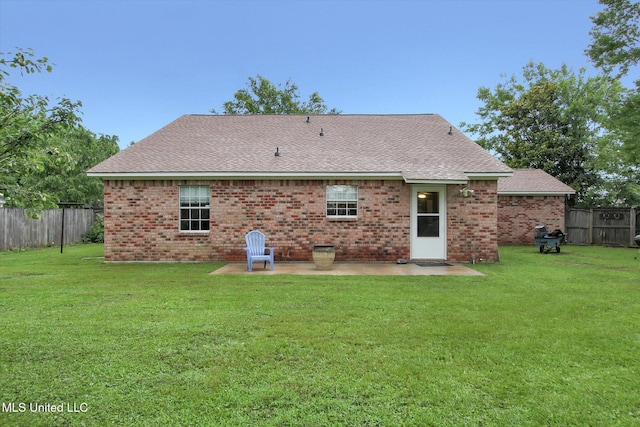 8809 Old Walnut Rd, Ocean Springs, MS 39564 - rear view of house featuring a patio area, brick siding, and a shingled roof
