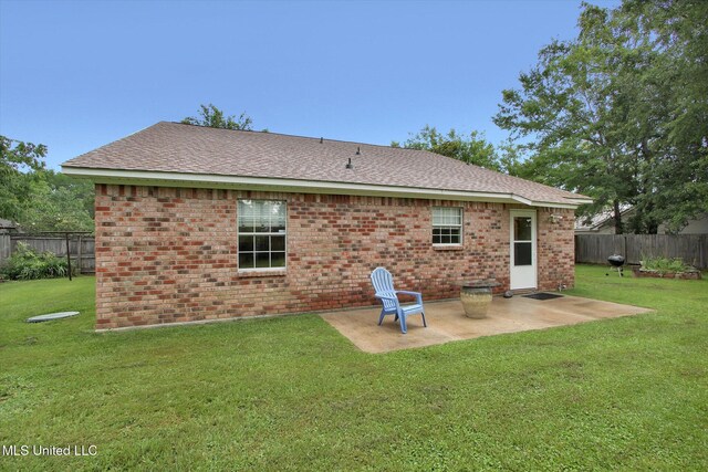 8809 Old Walnut Rd, Ocean Springs, MS 39564 - back of house with a patio, roof with shingles, and brick siding