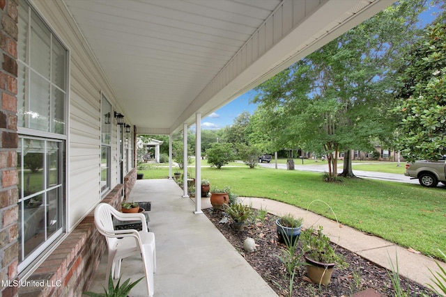 8809 Old Walnut Rd, Ocean Springs, MS 39564 - porch featuring a yard
