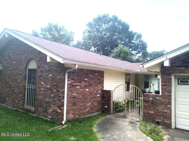 view of side of home with a garage