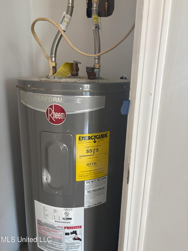 utility room featuring electric water heater