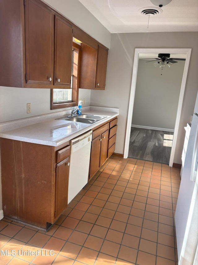 kitchen with ceiling fan, dishwasher, light tile patterned flooring, and sink