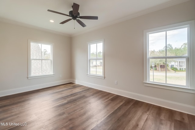 spare room featuring recessed lighting, dark wood-type flooring, a ceiling fan, baseboards, and ornamental molding