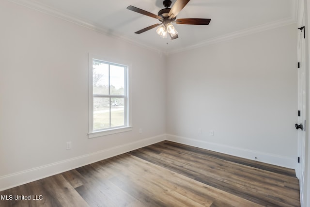 empty room featuring crown molding, dark wood finished floors, baseboards, and a ceiling fan