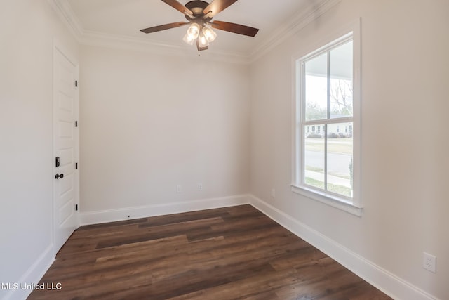 unfurnished room featuring crown molding, ceiling fan, dark wood finished floors, and baseboards