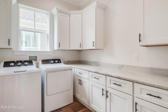 laundry room with cabinet space, dark wood-style floors, and separate washer and dryer