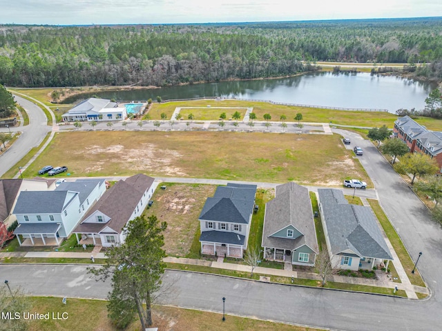 bird's eye view with a water view, a wooded view, and a residential view