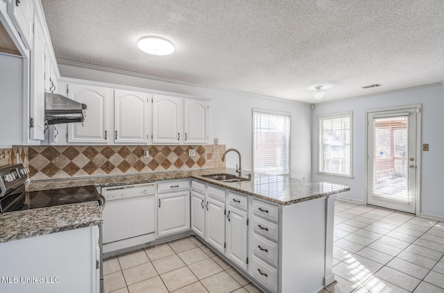 kitchen with stone counters, white dishwasher, sink, white cabinetry, and kitchen peninsula