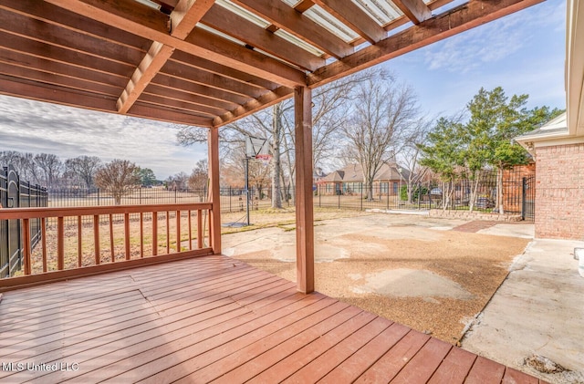 wooden terrace featuring basketball hoop